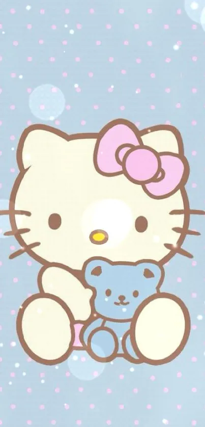 Cute kitty with teddy bear on blue polka dot wallpaper.