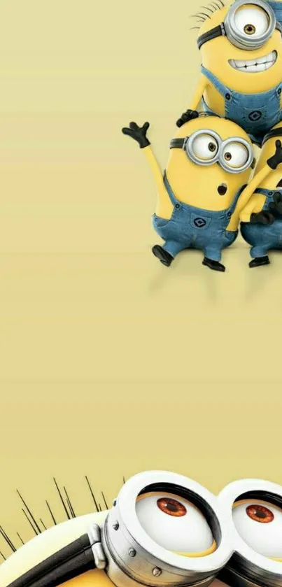 Adorable Minions on light yellow background.