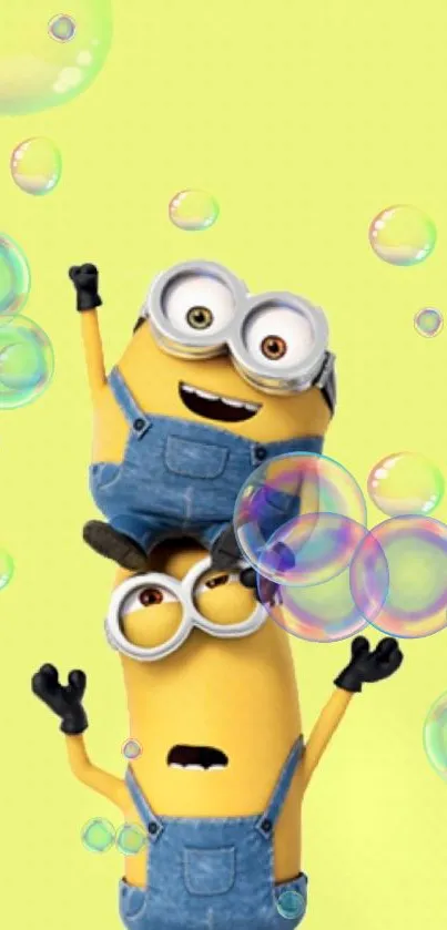 Two playful minions with bubbles on a bright yellow background.