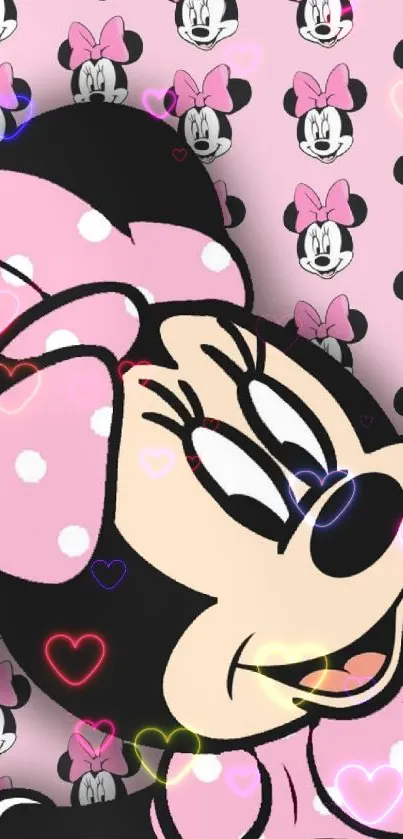 Minnie Mouse wallpaper with pink polka dots and cute design.