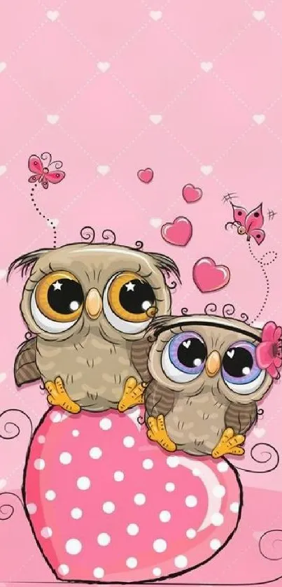 Two cute owls on a pink heart with polka dots, perfect wallpaper for mobiles.