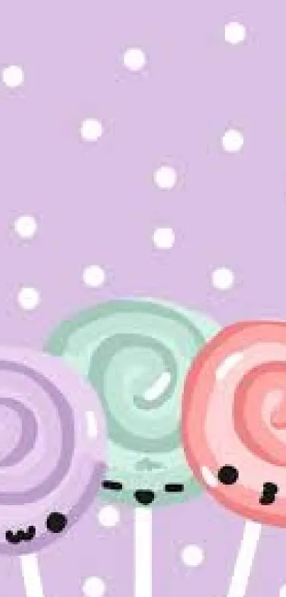 Cute pastel lollipop wallpaper with purple polka dots.