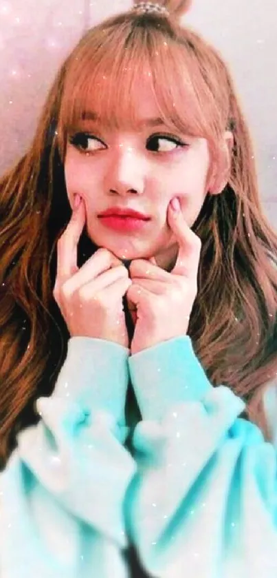 Auburn-haired person in a pastel blue hoodie looking sideways.