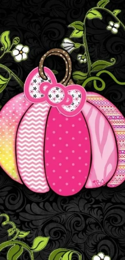 Cute pink pumpkin with floral vines on black background.