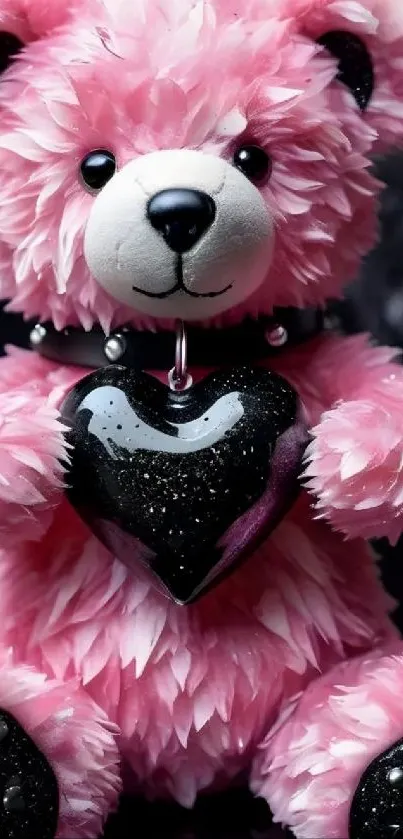 Cute pink teddy bear with black heart toy.