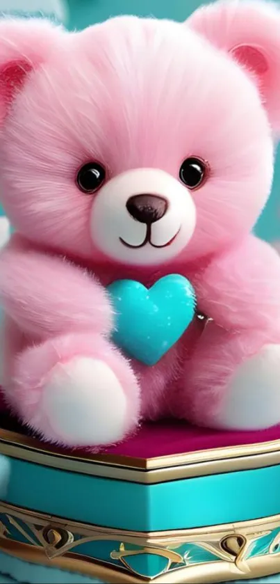 Pink teddy bear holding a blue heart on a box.