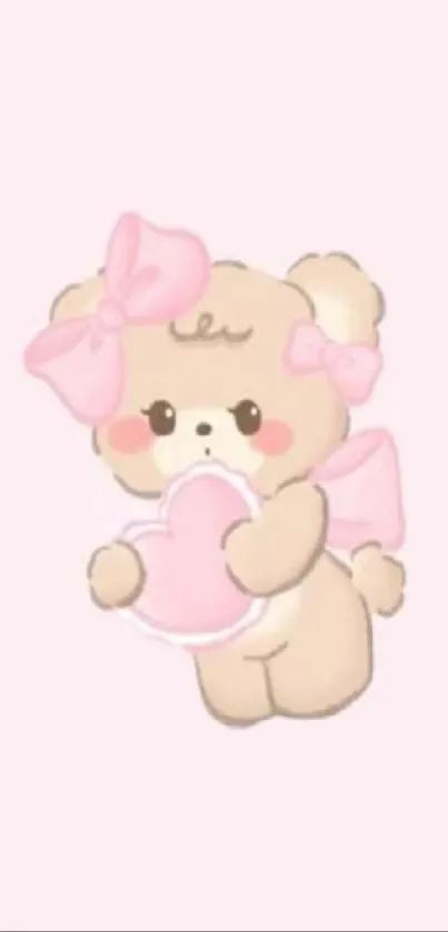 Cute pink teddy bear holding a heart on a light background.