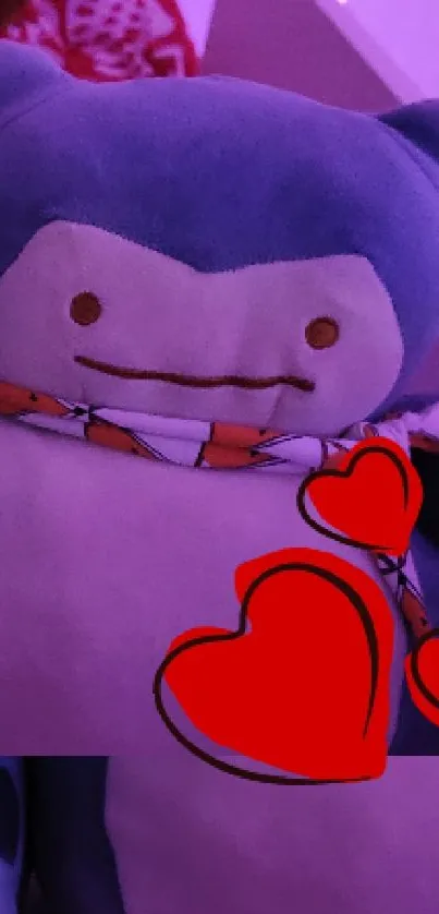 Cute plush toy with red hearts on a purple background.