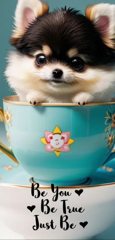 Adorable puppy in a teal teacup with motivational text.