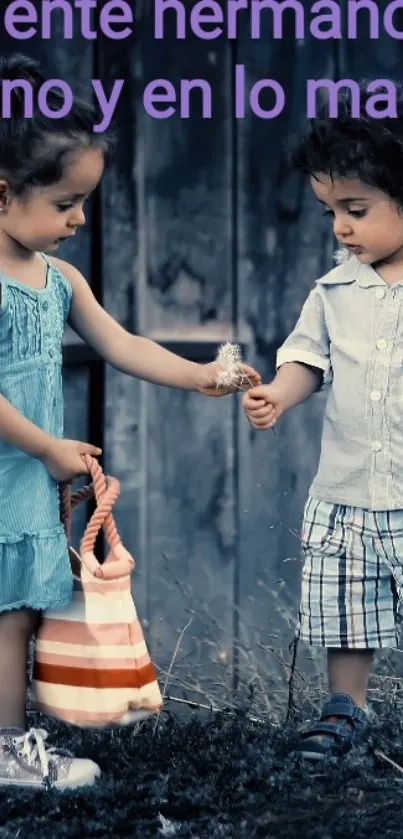 Cute siblings sharing a moment outdoors in blue attire.