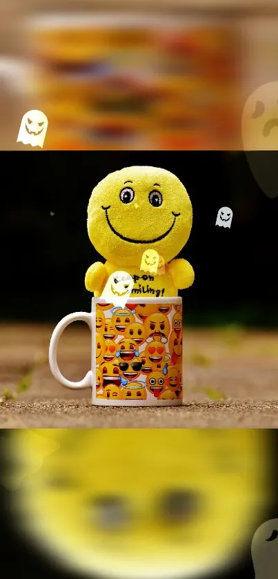 Yellow smiley face plush toy in a mug with ghost emojis on dark background.