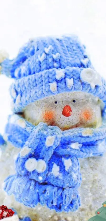 Charming snowman with blue hat and scarf in winter scene.