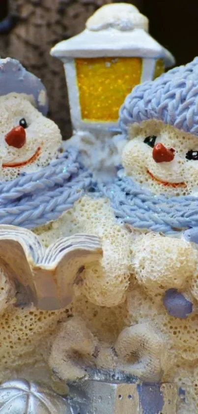 Two snowmen in blue scarves with a glowing lamp, winter theme.