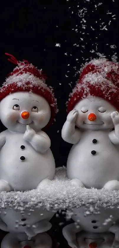 Four cute snowmen in red hats with falling snow on a reflective surface.