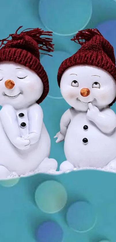 Two snowmen with red hats on a blue background, perfect for winter.