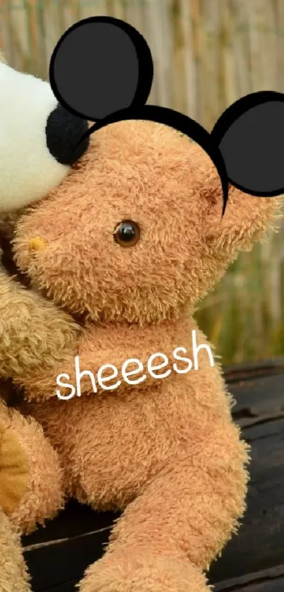 Two cute teddy bears hugging on a rustic log.