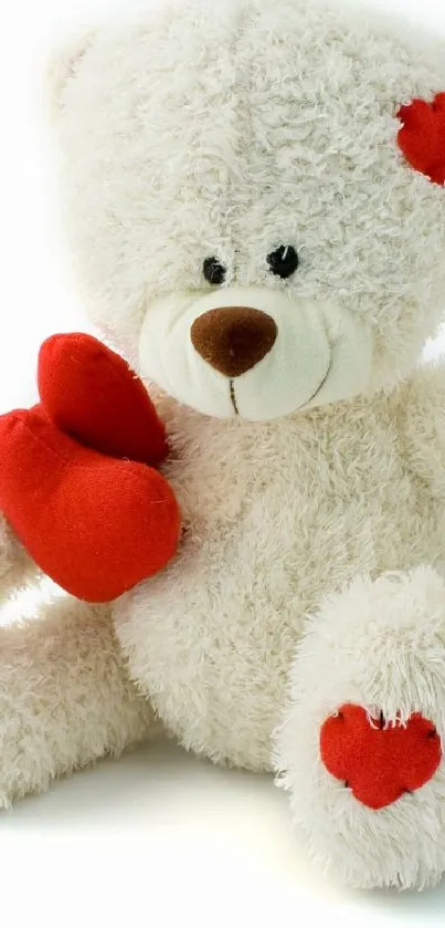 Adorable white teddy bear with red heart accents on a soft background.