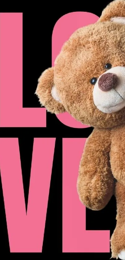 Teddy bear with pink love text on black.