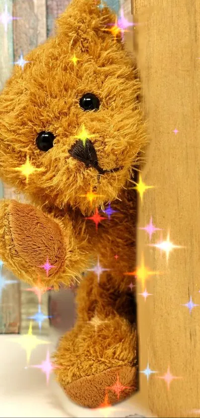 Cute teddy bear peeking with colorful sparkles.