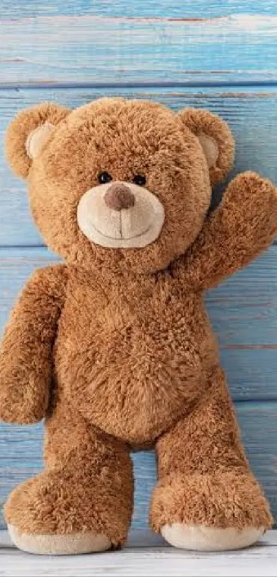 Teddy bear against blue wooden wall.