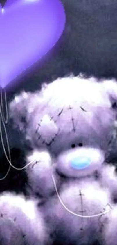 Fluffy teddy bear with purple heart balloon on dark background.