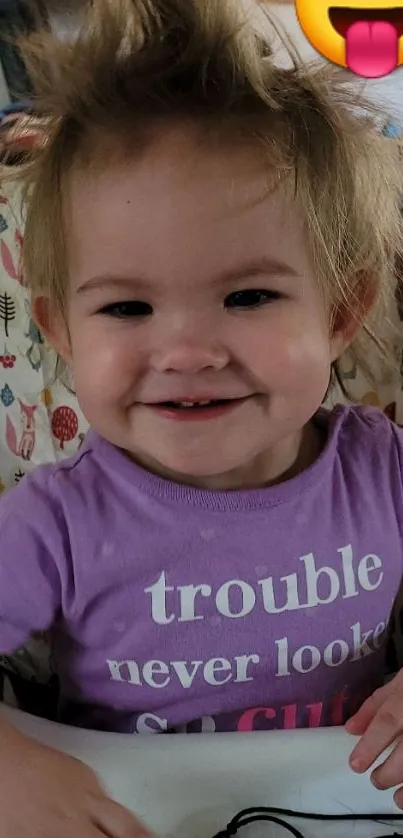 Cute toddler with playful hair and emoji face.