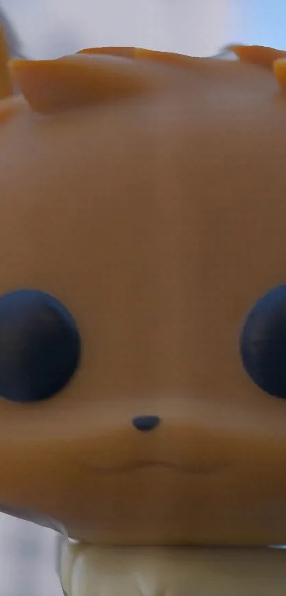 Close-up of a cute brown toy character for mobile wallpaper.