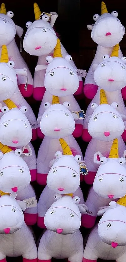 Cute white and pink unicorn plush toys arranged neatly.