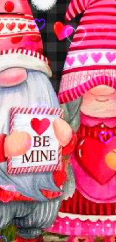 Cute Valentine gnomes with pink and red hearts on mobile wallpaper.