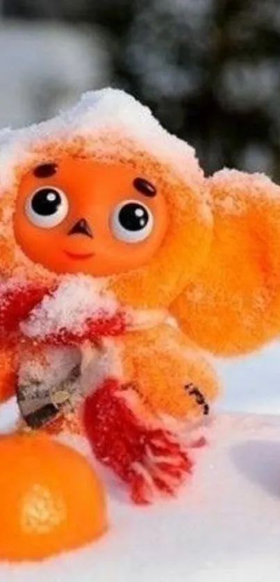 Adorable orange toy in snow, winter theme wallpaper.