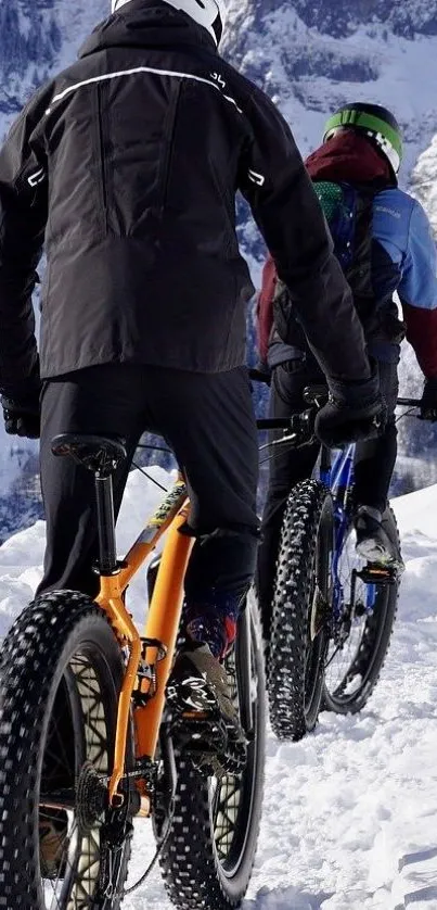 Cyclists biking through snowy mountain trails, embracing winter adventure.