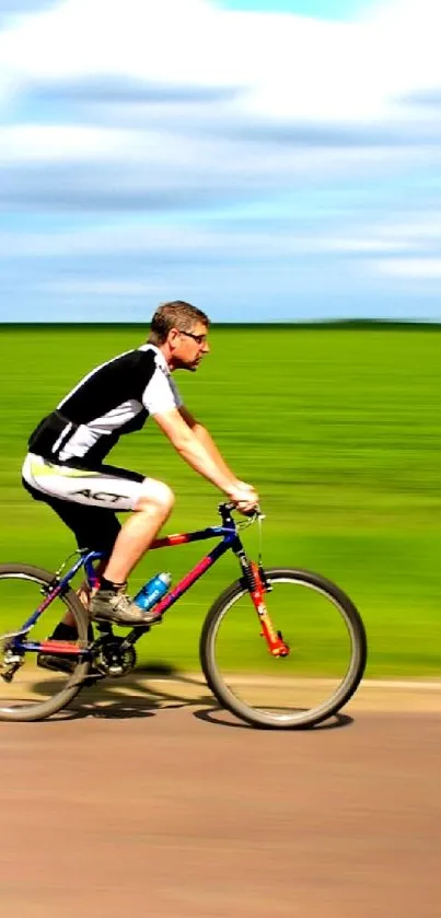 Cyclist zooming on a rural road with lush green background.