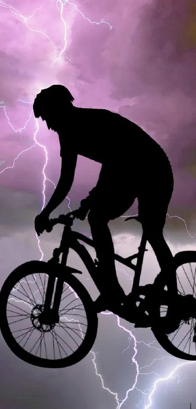 Cyclist silhouette with lightning in pink sky.