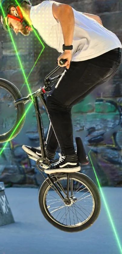 BMX rider performing a stunt with green laser and graffiti in background.