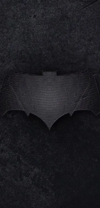 Dark bat symbol on textured black background wallpaper.