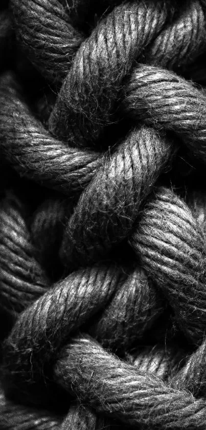 Dark braided rope texture in monochrome for mobile wallpaper.