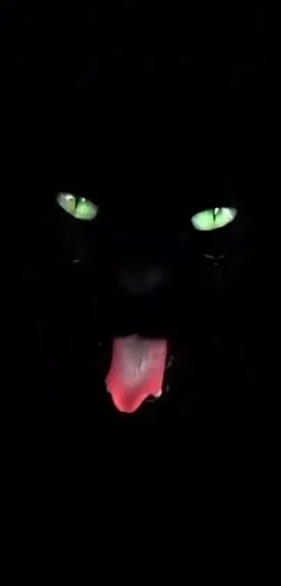 Dark wallpaper with glowing cat eyes and red tongue.