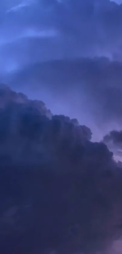 Dark cloudy night sky with purple hues for mobile wallpaper.