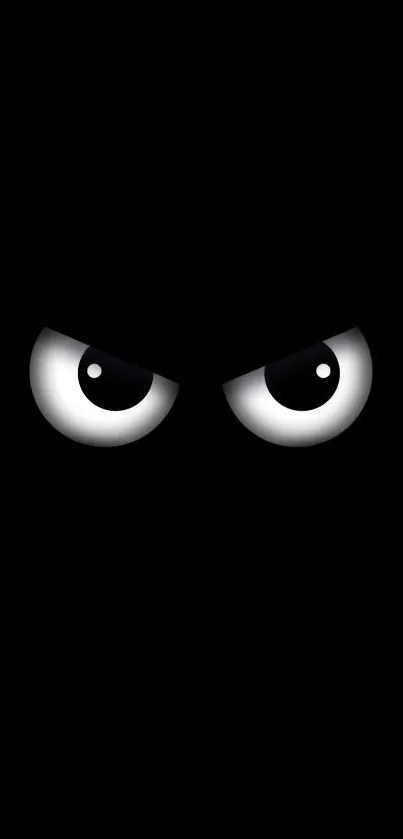 Dark mysterious eyes on black background wallpaper.