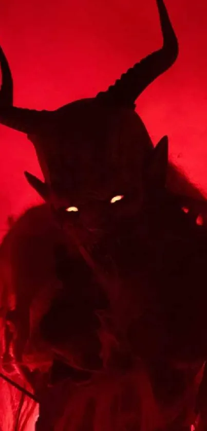 Silhouette of a horned demon with fiery red background.