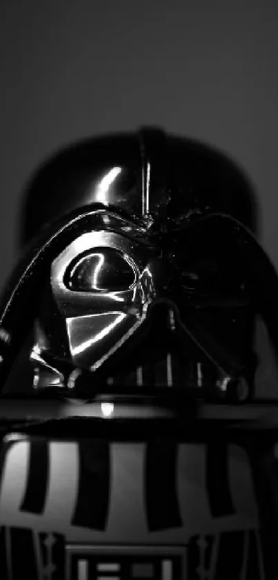 Black and white image of a dark, iconic sci-fi figure with a glowing lightsaber.