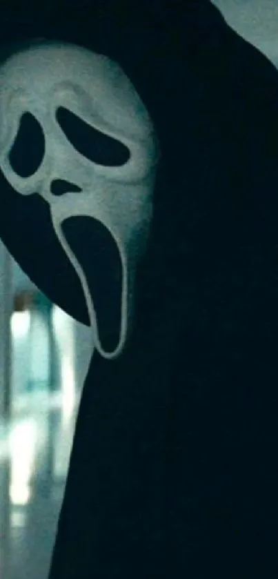 Eerie ghost mask in dark-themed wallpaper.