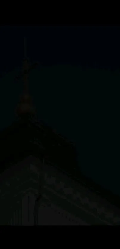 Gothic steeple silhouette against night sky, creating a dark, mysterious ambiance.