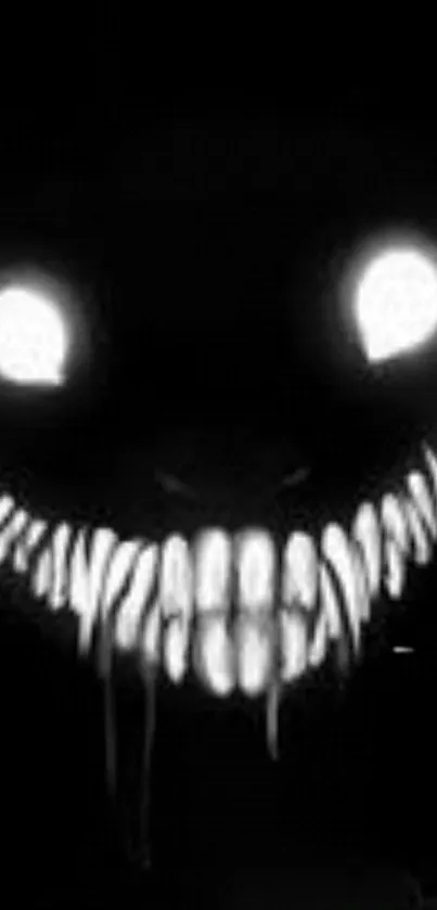 Eerie black wallpaper with a grinning monster face.