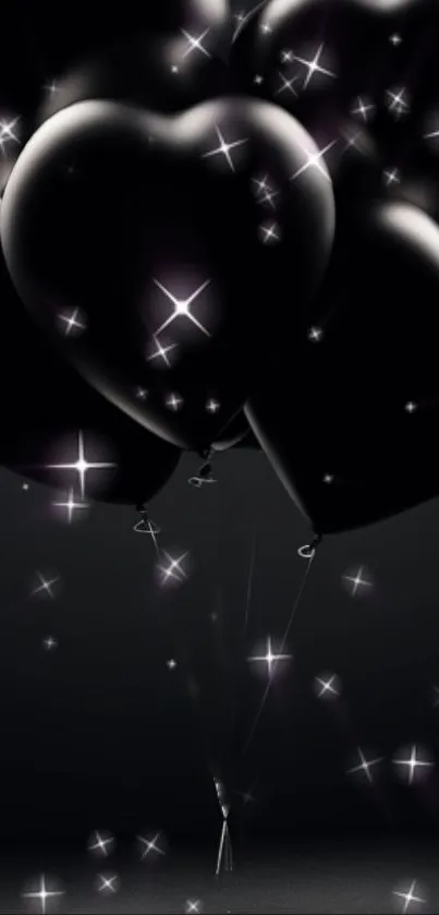 Dark heart-shaped balloons with sparkling highlights on a black background.