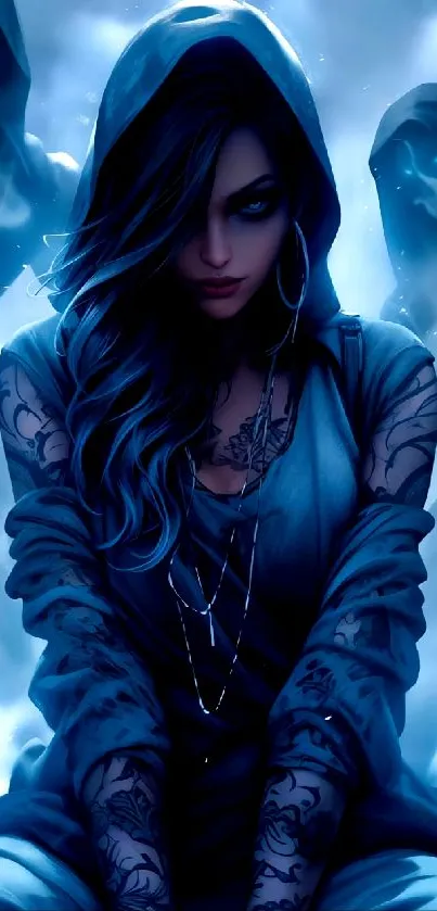 Dark hooded woman with tattoos in a mystical blue aura.