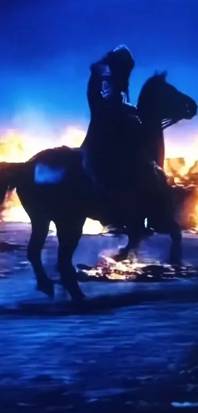 Silhouette of a horse standing against a fiery backdrop at night.