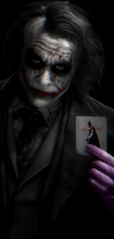 Joker holding a card in grim darkness.