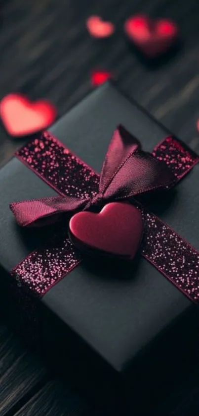 Dark gift box with red hearts and ribbon.