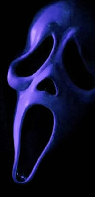 Dark purple mask on a black background, eerie and mysterious.